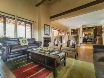 a living room with couches and a coffee table at Nyala's Corner @ Zebula in Mabula