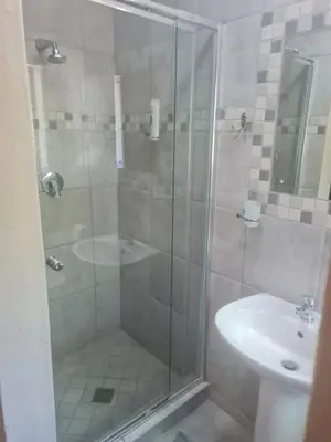 a bathroom with a shower and a sink at marlothpride in Marloth Park