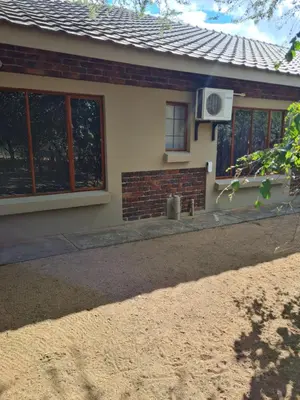 a house with a window and a air conditioner at marlothpride in Marloth Park