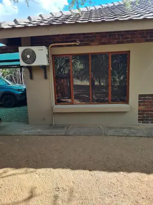 a house with a door and a window at marlothpride in Marloth Park