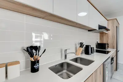 a kitchen with a sink and a counter top at Luxury apartment in Kyalami in Midrand