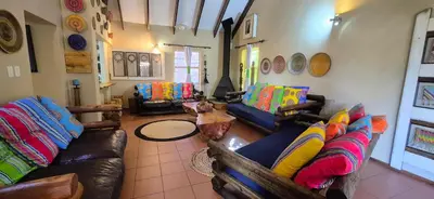 a living room with couches and a table at UrbanEscape in Centurion