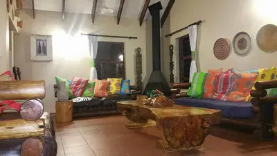 a living room with a couch and a table at UrbanEscape in Centurion