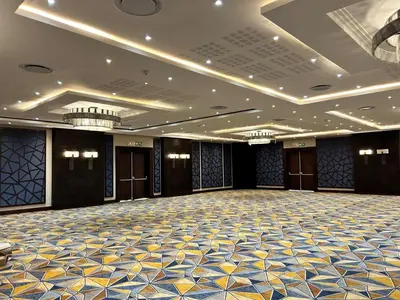 an empty ballroom with a large room with a ballroomasteryasteryasteryastery at Premier Hotel Thohoyandou in Thohoyandou