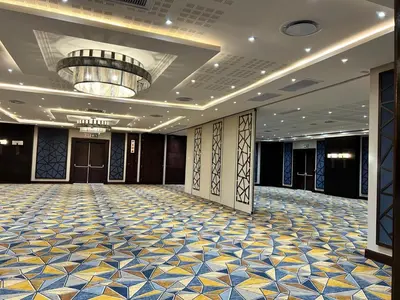 a large room with a large ballroom with a ceiling at Premier Hotel Thohoyandou in Thohoyandou