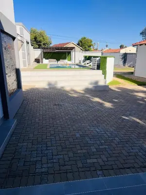a brick walkway in front of a building at Zindiza Guesthouse 2 in Witbank