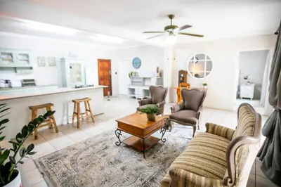 a living room with a couch and a table at Buchan's corner Unit 1 in Hartbeespoort
