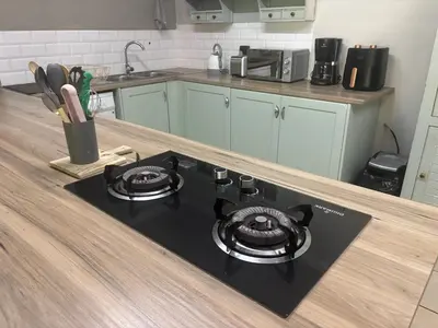 a kitchen counter with a stove top in a kitchen at Buchan's corner Unit 1 in Hartbeespoort