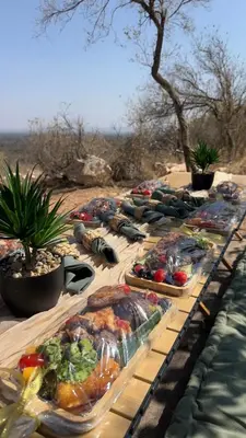 a long table with many plates of food on it at 22 Siyanda Mabalingwe in Mabula
