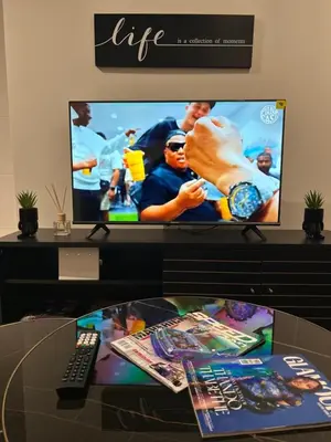 a computer monitor sitting on top of a desk at Waterfall Paradise Entire Executive 1 Bed Apt in Midrand