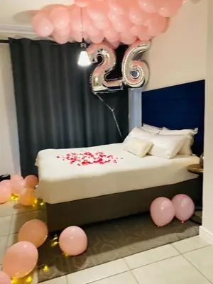 a room with a bed with a bunch of balloons at Waterfall Paradise Entire Executive 1 Bed Apt in Midrand
