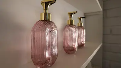 three clear glass vases on a shelf in a room at Stay at Percy Self Catering House in Nelspruit