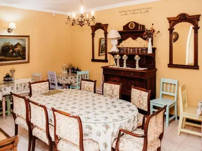 a dining room with a table and chairs at Grace View Guest House in Secunda