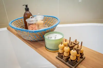 a wooden tray with food and a basket and a candle at Pecanwood Retreat - Pecanwood Golf Estate - Hartbeespoort in Hartbeespoort