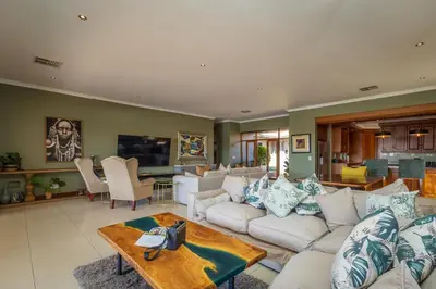 a living room with a couch and a table at Pecanwood Retreat - Pecanwood Golf Estate - Hartbeespoort in Hartbeespoort