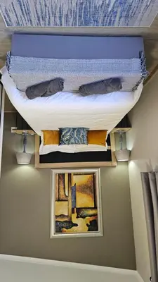 a bunk bed in a room with two pictures at 189 Luxury Suite -Not availible anymore! in Centurion