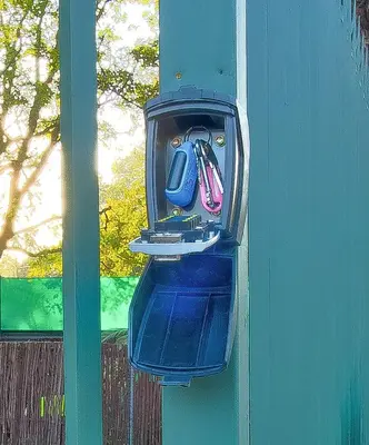 a rear view mirror of a blue car on a wall at Luxurious self-catering villa, step-free and pet-friendly in Centurion