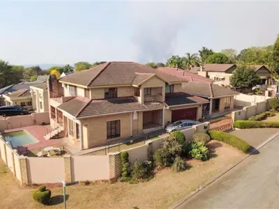 an aerial view of a large house with a fence at Southern Sun Hotels in Tongwe