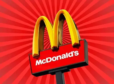 a mcdonalds sign in front of a red background at Southern Sun Hotels in Tongwe