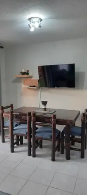 a dining room with wooden tables and benches at Faerie Glen, No Loadshedding, Short or Long Stays, Fast Wi-Fi in Pretoria