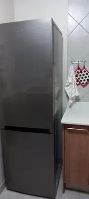 a stainless steel refrigerator in a kitchen next to a counter at Faerie Glen, No Loadshedding, Short or Long Stays, Fast Wi-Fi in Pretoria