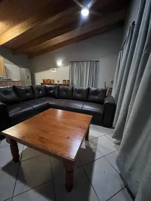 a living room with a couch and a coffee table at Lowveld Sleepover in Tzaneen