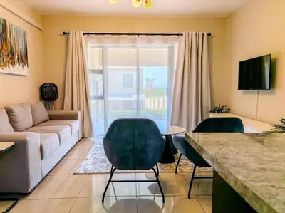 a living room with a couch and two chairs at Self checkin - Modern Haven 2 Bedroom 43 in Nelspruit