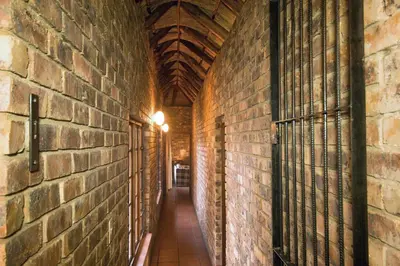 an alley in a building with a brick wall at The Sanctuary in Mabalingwe Nature Reserve in Mabula