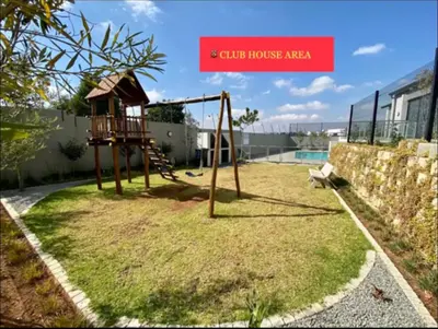 a playground with a swing set in a yard at Ladybug ladybug in Midrand