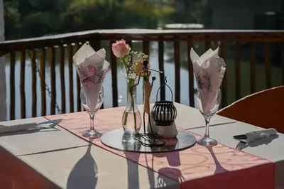 a table with three vases with flowers on it at Pioneer lodge in Lephalale
