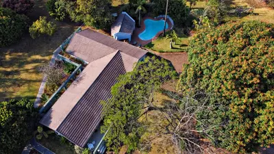 an overhead view of a house with a pool at ilanda Guest House in White River