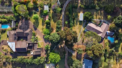 an aerial view of a house with trees at ilanda Guest House in White River