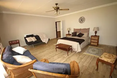 a living room with a bed and a couch at Clartal's Place in Isidule