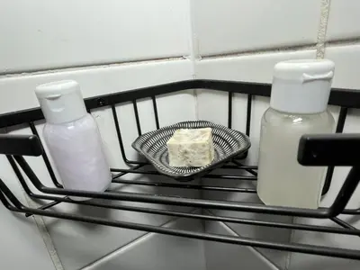 a piece of cake on a plate on a shelf at Kiewiets Cradle Guest House in Pretoria