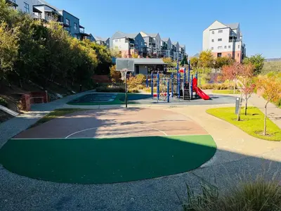 a park with a playground with a playgroundfficientfficientfficientfficientfficientfficient at Secure 1 Bedroom Apartment in Midrand, Waterfall City - Lock Up and Go - Free WIFI and Parking - 6A Elizabeth Place in Midrand