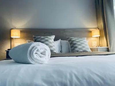 a towel sitting on top of a bed at 23 On Jupiter in Polokwane