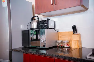 a microwave on top of a counter in a kitchen at Falcon Lodge ET in Bela-Bela