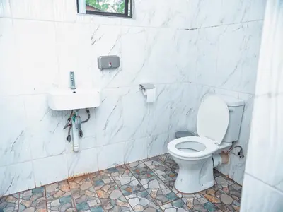 a bathroom with a toilet and a sink at Falcon Lodge PK in Bela-Bela