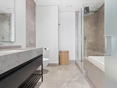 a bathroom with a sink and a tub and a toilet at Ellipse Waterfall 3909 in Midrand