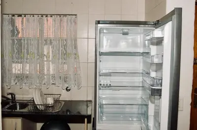 a refrigerator with its door open in a kitchen at Palm Haven 5 min drive to Carlswald Centre in Midrand