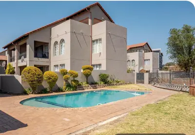 a house with a swimming pool in front of it at Palm Haven 5 min drive to Carlswald Centre in Midrand