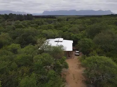 an aerial view of a small building in a forest at The Eco Hut in Hoedspruit