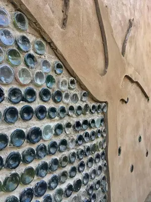 a pile of wine bottles sitting on the ground at The Eco Hut in Hoedspruit