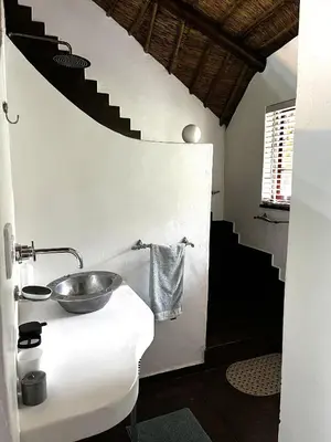 a bathroom with a bowl on a counter with a sink at Wood Valley in Midrand
