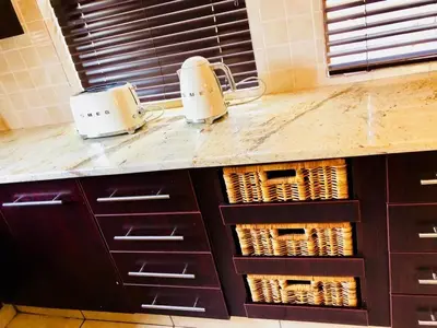 two toasters sitting on a counter in a kitchen at Villa on 8 Pecanwood in Hartbeespoort