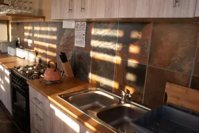 a kitchen with a sink and a stove at Casa de la Presa 1 in Polokwane