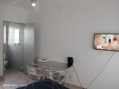 a bathroom with a table and chairs and a tv at 7 Geelhout Ave in Nelspruit