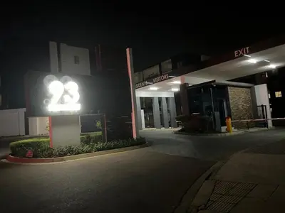 a gas station at night with a sign that says at Cozy retreat in Carlswald 264 in Midrand
