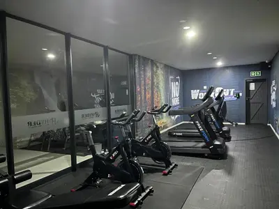 a gym with several exercise bikes in a room at Cozy retreat in Carlswald 264 in Midrand