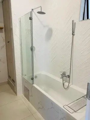 a bathroom with a shower and a bath tub at Cozy retreat in Carlswald 264 in Midrand